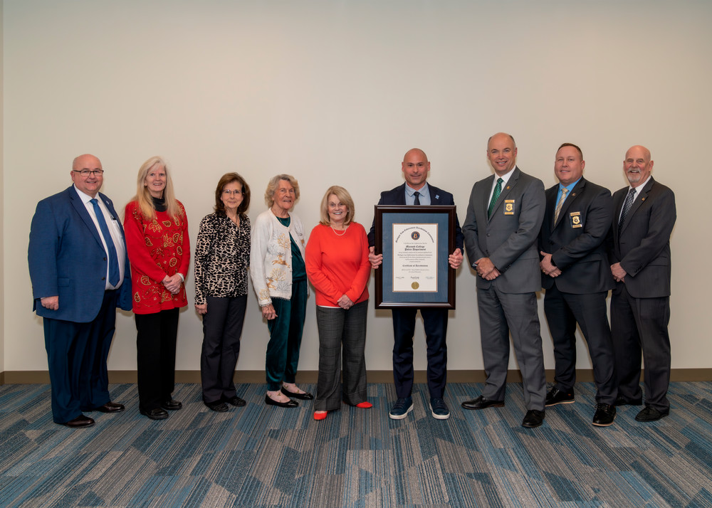 The Macomb Community College Police Department is among the 14% of law enforcement agencies in the state to earn accreditation. (From right to left), Robert Stevenson, executive director, Michigan Association of the Chiefs of Police (MACP); Bryan Ergang, MCAP president and chief, Kalamazoo Police Department; and Ron Wiles, deputy director and accreditation program director, MACP, presented a plaque commemorating the achievement to Macomb College Police Chief William Leavens;  Macomb Community College board of trustees members Katherine Lorenzo, chairperson; Joan Flynn, trustee; Roseanne DiMaria, treasurer; Kristi Dean, secretary; and James O. Sawyer IV, president, Macomb Community College. 